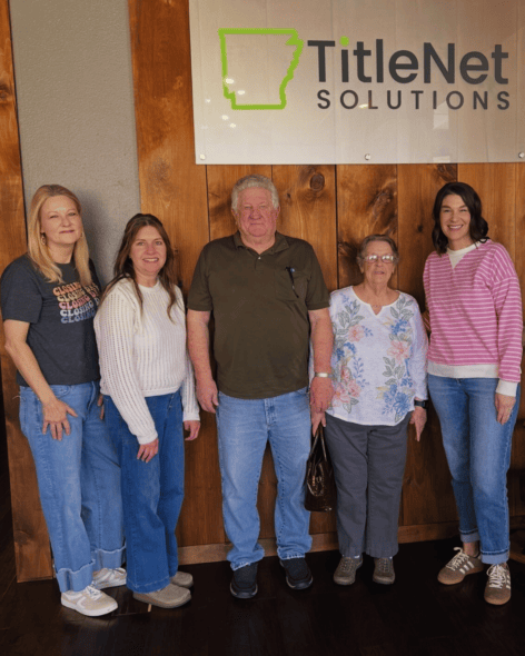 Group photo of Lea Ann Bryant's team at TitleNet Solutions office.