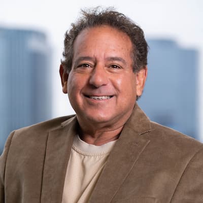 Preferred Rate expert Gary J. Danno smiling in a professional portrait.