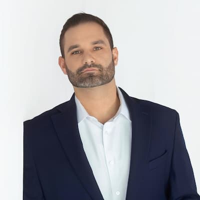 Professional portrait of Alex Gorman for Preferred Rate, showcasing expertise in mortgage and financ.
