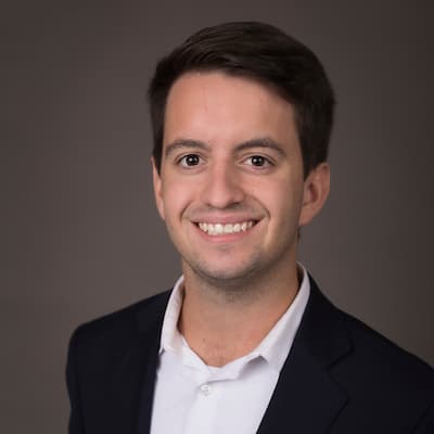 Kevin Jeffrey Cooper smiling in professional headshot for financial services.