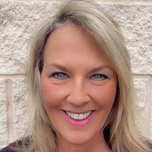 Melissa Dalberg smiling outdoors at Preferred Rate.