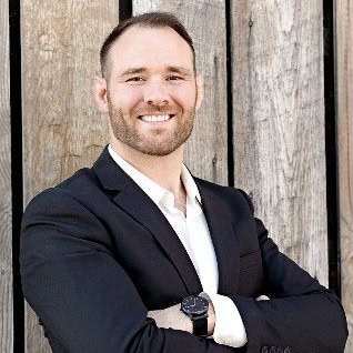 Professional portrait of James Bochnovic, a financial expert at Preferred Rate, smiling confidently.