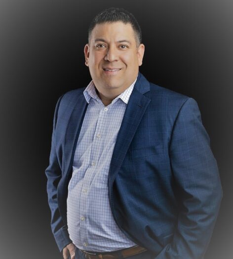 Professional portrait of Shane Loya in business suit for Preferred Rate.