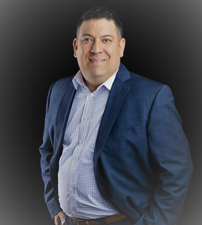 Professional portrait of Shane Loya in business suit for Preferred Rate.