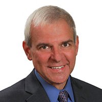 Professional man in suit representing Preferred Rate financial services.