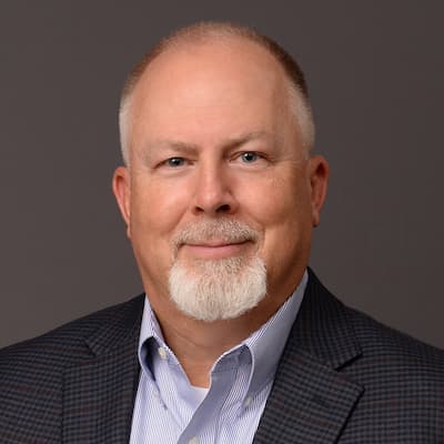 Professional portrait of Mark McCool, financial expert at Preferred Rate.