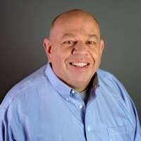 Steve Johnson smiling in a professional portrait for Preferred Rate.