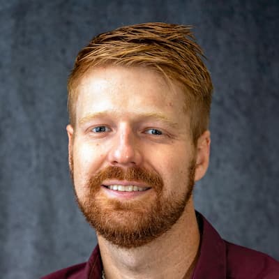 Matt Stacy smiling, professional headshot for financial services.