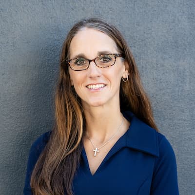Karen Brown smiling in a professional portrait for Preferred Rate.