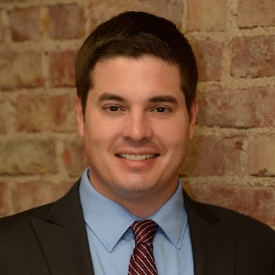 Professional portrait of Mitch Richards, financial advisor at Preferred Rate.