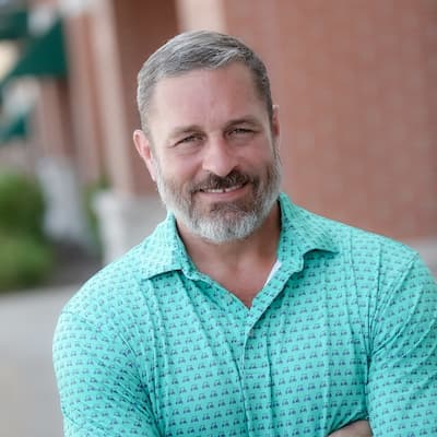 Wyatt Ragar smiling outdoors, representing trusted mortgage and financial services.