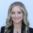 Nicole Dodd smiling, professional headshot for financial services.