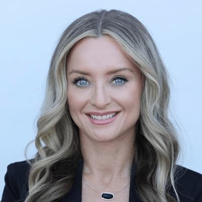 Nicole Dodd smiling, professional headshot for financial services.