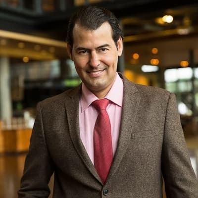 Professional portrait of Daniel J. Pagano, a financial expert at Preferred Rate, showcasing trust an.