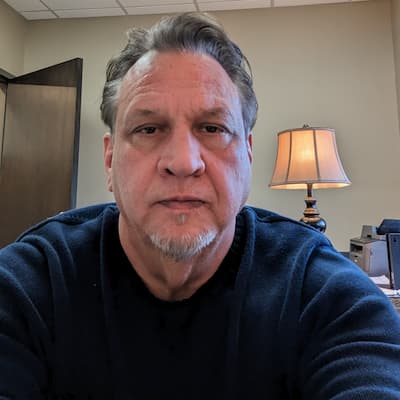 Johnny Gremm portrait in office for Preferred Rate.