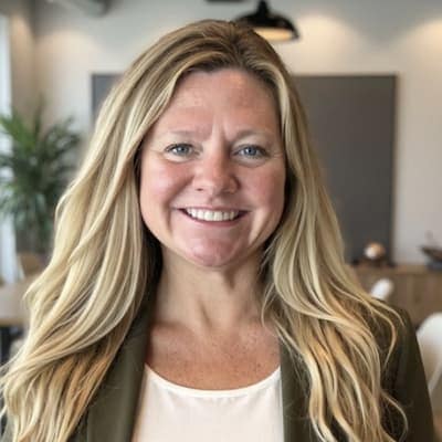 Melissa Robbins smiling in a professional setting at Preferred Rate.