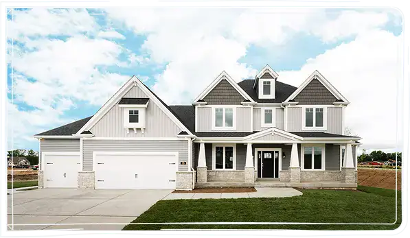 Beautiful modern two-story house with white and gray siding, large windows, and a spacious driveway.